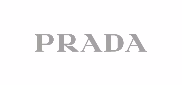 Prada brand wordmark logo in gray text on a white background.