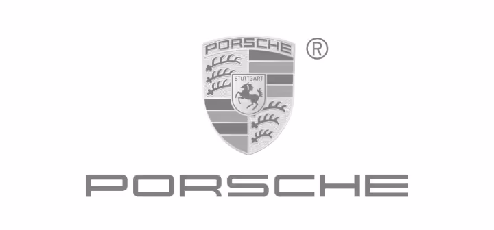 Porsche logo with a shield featuring a horse and antlers above the Porsche text.